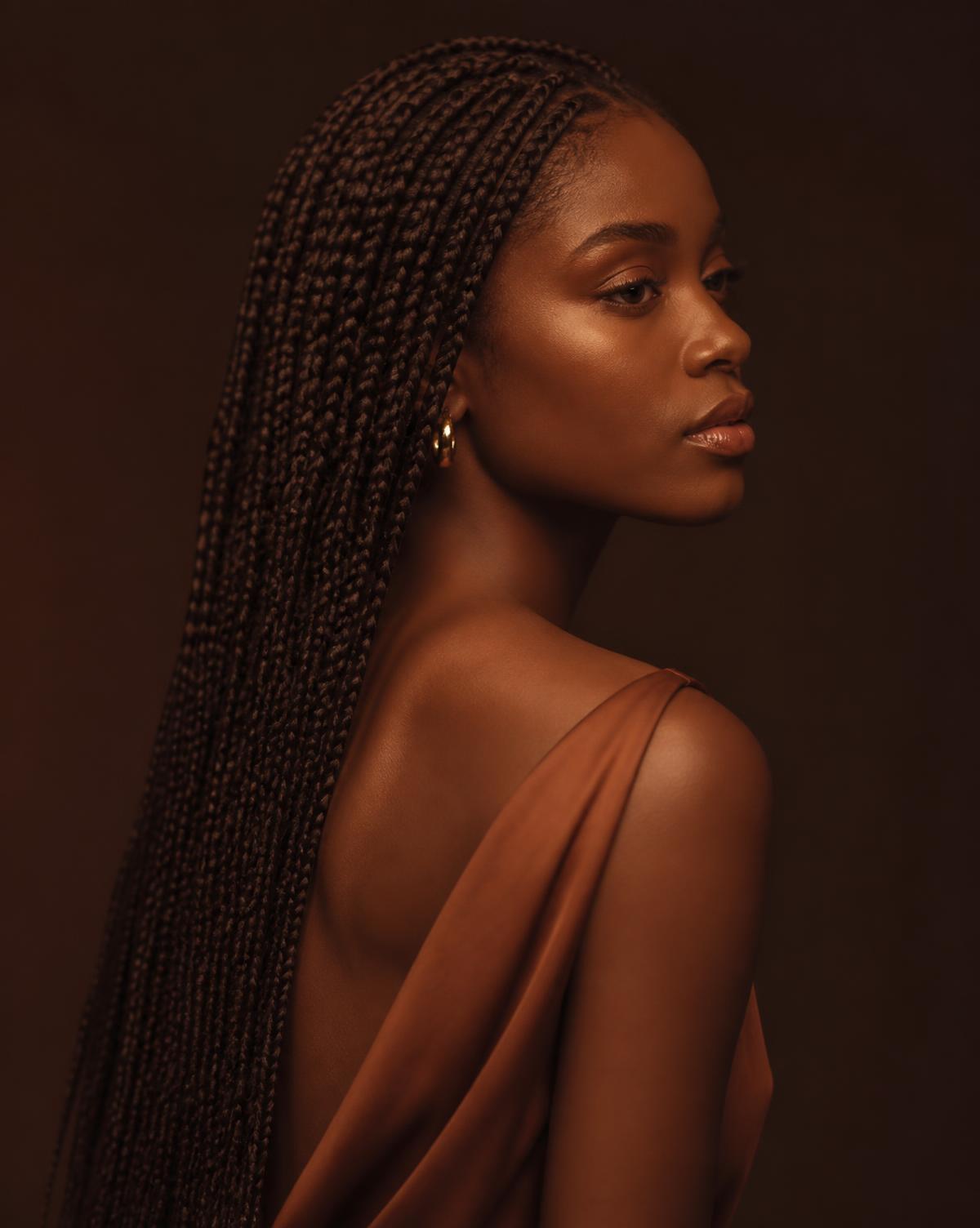 Cliente portant de longues box braids réalisées à domicile